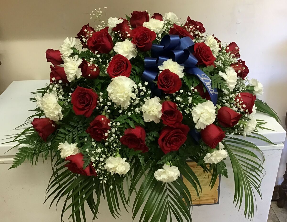 Red Roses and Carnations Casket Spray; Price starting at $175.00